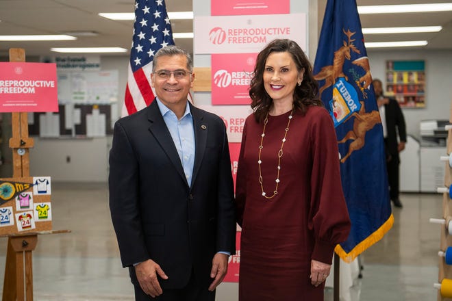 United States Secretary of Health and Human Services Xavier Becerra, left, and Governor Gretchen Whitmer, right, pose for a photo together after taking part in a roundtable discussion on reproductive freedom on Thursday, March 28, 2024 at the Hawk Community Center in Farmington Hills.