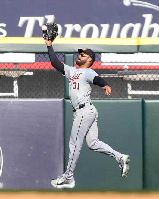 Tigers' Riley Greene jumps in the air to catch a deep fly ball from White Sox's Eloy Jimenez during the seventh inning.