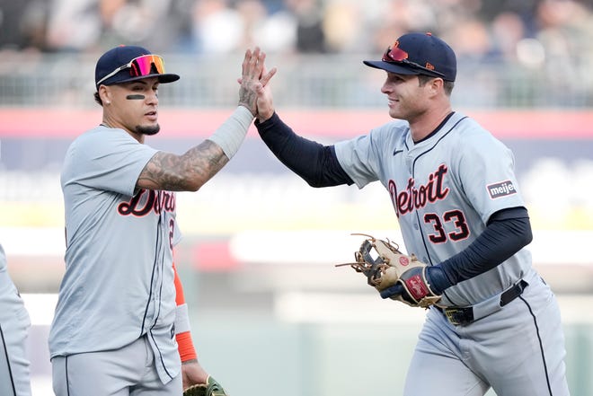 Detroit Tigers' Javier Baez, left, and Colt Keith celebrate the team's 1-0 shutout win over the Chicago White Sox in the season opener on Thursday, March 28, 2024, in Chicago.