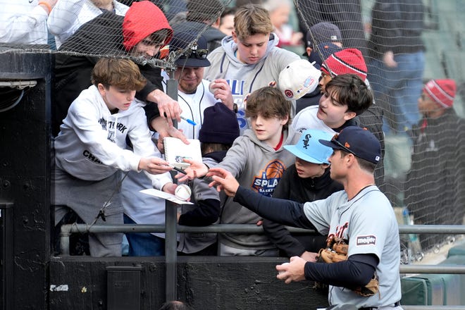 Tigers' Colt Keith signs autographs after the team's 1-0 shutout win over the White Sox.