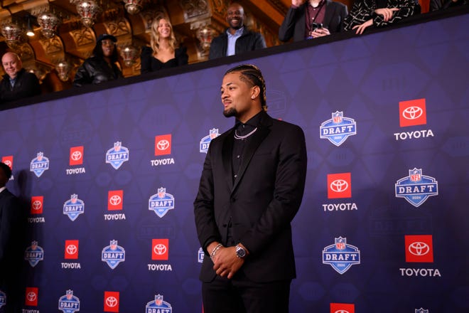 Washington wide receiver Rome Odunze poses for photos during the NFL Draft red carpet arrival, at the Fox Theatre, in Detroit, April 25, 2024.