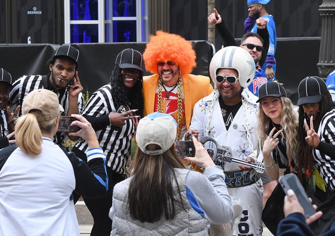 Fans get pictures of some interesting fans during the 2024 NFL Draft on the streets of Detroit.