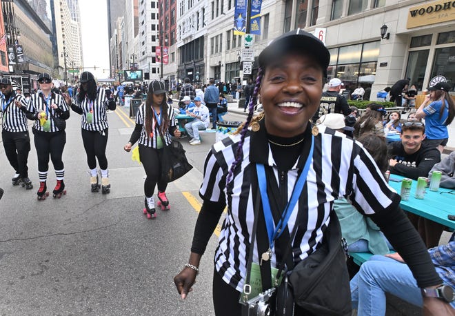 Shawn Stringer and members of the Roller Skate Detroit, advertising for the Somerset Collection and the Detroit Shoppe, skate down Woodward Avenue during the 2024 NFL Draft in Detroit.