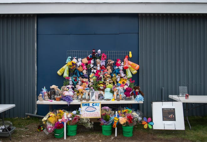 A shrine in remembrance of Alanah Phillips, 8, and Zayn Phillips, 4, is displayed before a vigil in their honor on Friday, April 26, 2024, at the Swan Boat Club in Newport, Michigan.