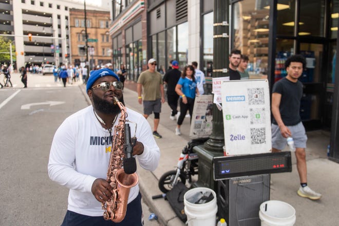 Aaron "Mack Magnum Sax" McAfee entertains the crowd as thousands attend the third day of the 2024 NFL Draft on Saturday.