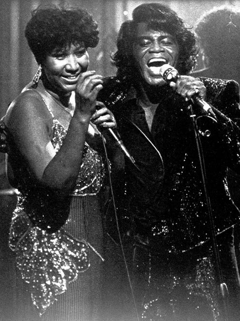 Singer James Brown joins Aretha Franklin for a performance at the Taboo night club in Detroit, Jan. 11, 1987, for a show which was taped for airing on HBO.