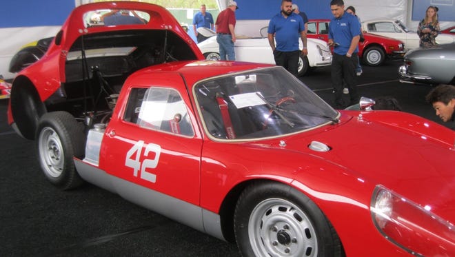 Raced, restored, and vintage raced, this 1964 Porsche 904, with fiberglass bodywork bonded to a boxed steel chassis, sold at auction for $1,540,000.