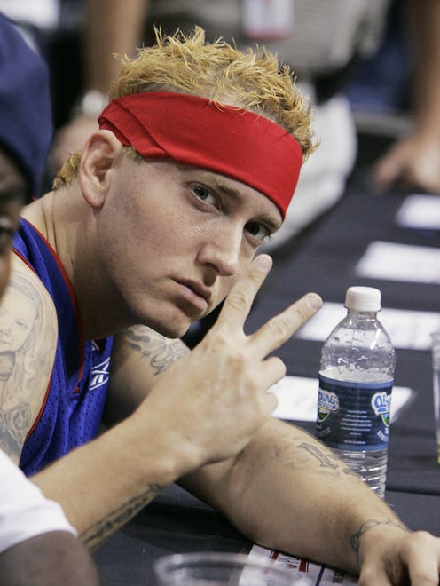 Rapper Eminem poses for the photographer as he cheers for the Pistons on June 16, 2005.