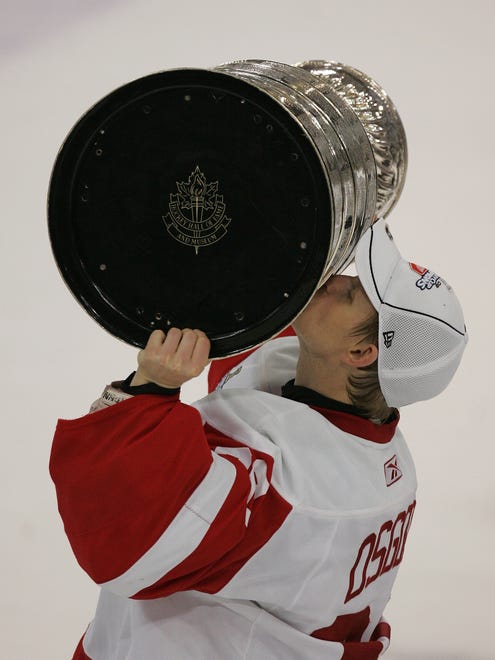 Red Wings goalie Chris Osgood kisses the Stanley Cup after Detroit defeated the Pittsburgh Penguins in the Stanley Cup Finals at Mellon Arena in Pittsburgh, Pennsylvania, on June 4, 2008.