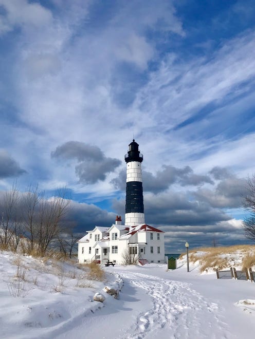"Winter Hike to Big Sable Point Light," by Tom Sovereign of St. Johns. It was a 3-mile hike at 13 degrees with 30 mph wind gusts blowing snow and sand. "But right when we arrived, the dark skies opened and the sun lit up Big Sable with those dark and white clouds, blue sky mixed in, and it was truly beautiful!" Sovereign said.