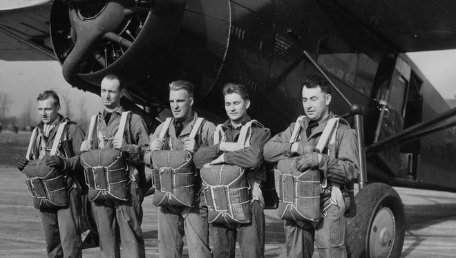 Members of the Michigan National Guard at Selfridge Field pose before a parachute jumping exercise on Nov. 17, 1934. From left are  Lester Helling, Arnold Filliberti, Eugene F. North, Frank  Witt and  James A. Graham.