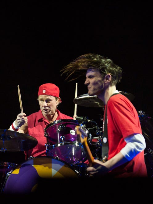 Red Hot Chili Peppers drummer Chad Smith (Bloomfield Hills) and guitarist Josh Klinghoffer play an instrumental jam to kick off the show at Joe Louis Arena Thursday.