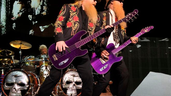 ZZ Top bassist Dusty Hill and guitarist Billy Gibbons perform at DTE in Clarkston in 2013.
