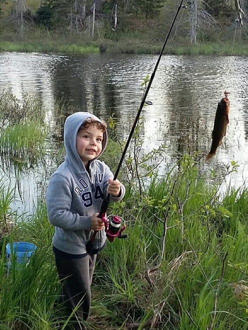 Busy toddler Owen Futrell, almost 3, loves the outdoors. His aunt, Annie King of Mohawk, says, "He was so excited for his first fishing adventure with his mom and dad" in Keweenaw County. "When Owen felt a fish bite, he snatched the pole back, trying to drag the fish to shore. Once he saw the fish he caught, his face lit up."