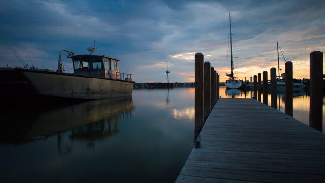 Matt Vailliencourt of Brighton had a plan when he set up his camera in Leland.  "I chose to shoot the sunset from the harbor because the dock and breakwater led my eyes right to the sun," he said.  A fishing boat in the fading light added the perfect bit of serendipity.