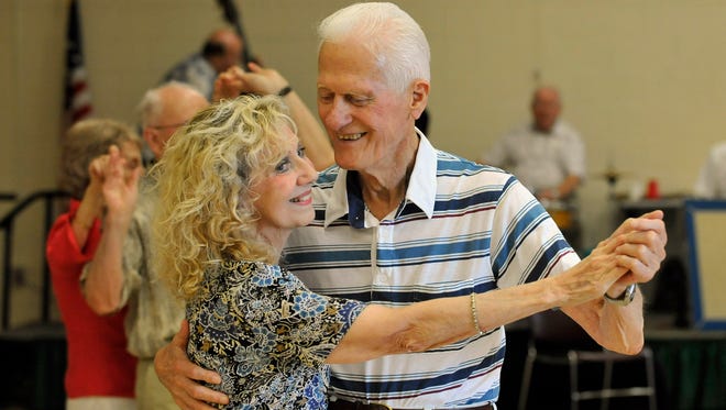 Mary Jane Pope of Farmington dances with Irving Szokola of Livonia  during the Wednesday afternoon ballroom dance inside the Livonia Civic Park Senior Center. on  July 27, 2011.