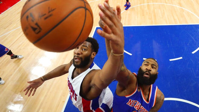 Andre Drummond of the Pistons battles for a rebound against Kyle O'Quinn of the New York Knicks on March 11, 2017.