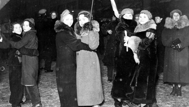 Women dance together outside General Motors plant 1, during the Flint sit-down strike,1936-37.