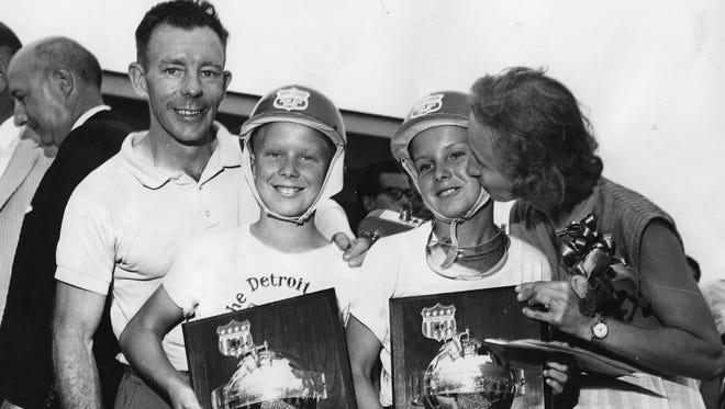The Detroit and Suburban Motor City Soap Box Derby champs, brothers Thomas J. Shorkey, 11, and Patrick J. Shorkey Jr., 13, display their trophies with proud parents Patrick and Winifred Shorkey in 1964. The boys were part of a family of eight kids, and were headed to Akron, Ohio, to compete for a share in $30,000 in college scholarships to be awarded to the winners in the All-American Soap Box Derby.