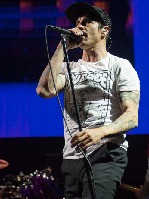 Grand Rapids native and Red Hot Chili Peppers singer Anthony Kiedis performs on stage at Joe Louis Arena in Detroit.
