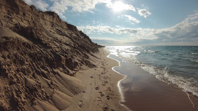 Chelsea Borkovich of Fort Gratiot was on a backpacking trip along the Lake Michigan shore.  "We took a quick break from hiking to swim in the lake and take a few photos," she said. She titled this one "Michigan’s Mountains - Sleeping Bear Dunes."