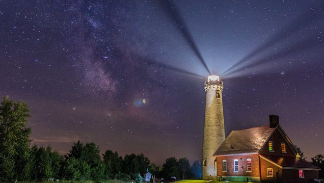 Best digitally enhanced photo: "Starlight House," by Joshua Kallio of Berkley.  It shows the Tawas Point Lighthouse shining its beams into Lake Huron. "There are places in Michigan that seem unreal," he said.