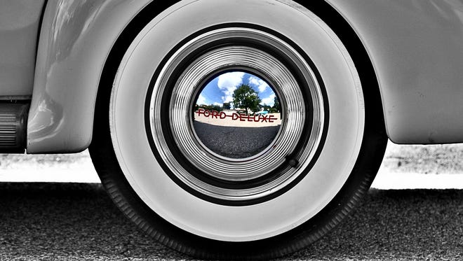 Regina Abraham of Plymouth came upon four classic cars when she was out doing some errands, pulled over and started photographing the cars.  “I thought the white-wall tires were interesting so when I crouched down to photograph them I noticed the reflection of a home on a beautiful summer day,” she said. “The tricky part was to not get myself or camera in the shot.“