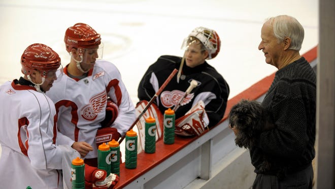 (from left) Kris Draper, Kirk Maltby, Chris Osgood, and Gordie Howe with his dog Rocket, all chat during practice at Joe Louis Arena, in Detroit, April 14, 2009.