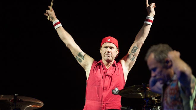 Hometown rock-n-roll hero Chad Smith, who grew up in Bloomfield Hills and graduated from Lahser High School, acknowledges the crowd as he and his bandmates his the stage at Joe Louis Arena in Detroit on their Getaway World Tour on Tuesday, January 31, 2017.