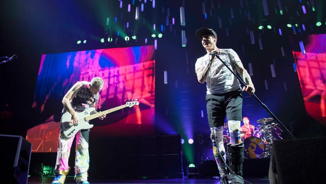 Red Hot Chili Peppers bassist Flea and singer Anthony Kiedis performs on stage at Joe Louis Arena in Detroit during the band's Getaway World Tour.