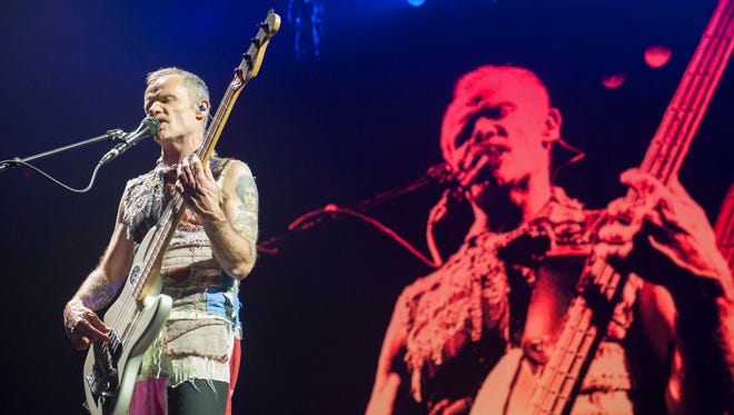 Red Hot Chili Peppers Bassist Flea (Michael Peter Balzary) performs on stage at Joe Louis Arena in Detroit during the band's Getaway World Tour.