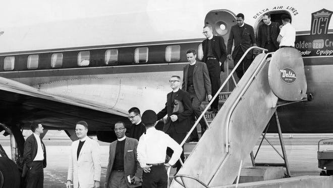 Freedom Riders deplane on Sept. 20, 1961, after a trip to southern states to highlight the illegal segregation of races on public buses.  The civil rights activists rode buses in the South in mixed racial groups and often were met with violence.