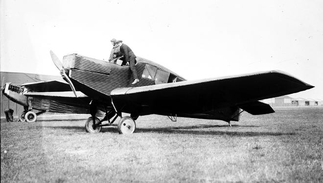 Eddie Stinson boards one of his Stinson airplanes on June 3, 1928.