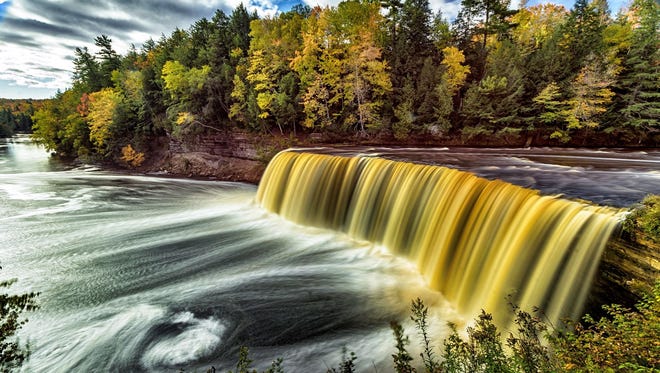 "Tahquamenon Falls Fall," by Tom Clark of Essexville, was shot last October. He was chasing waterfalls and fall colors and found both in a classic shot of the upper falls.