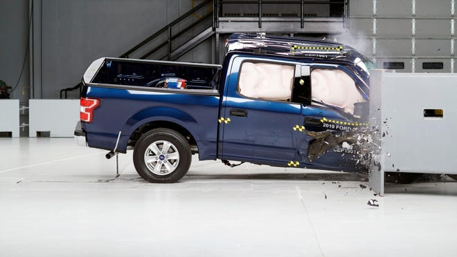 Action shot taken during the passenger-side small overlap frontal crash test of the 2019 Ford F-150 SuperCrew.