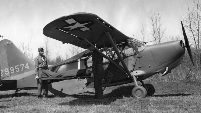 A Stinson L5-B Army air ambulance is seen on June 14, 1944.  The Stinson Aircraft Corporation was established southwest of Detroit, where Detroit Metro Airport later would be located.
