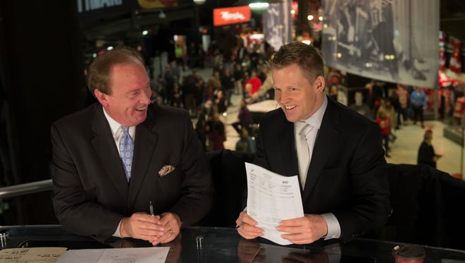 Fox Sports on-air talent John Keating and Chris Osgood broadcast the pregame show on Fox Sports Detroit from above the concourse at Joe Louis Arena in Detroit, November 21, 2013.
