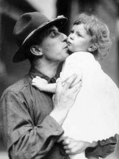 A father drafted into World War I kisses his child goodbye in Detroit.