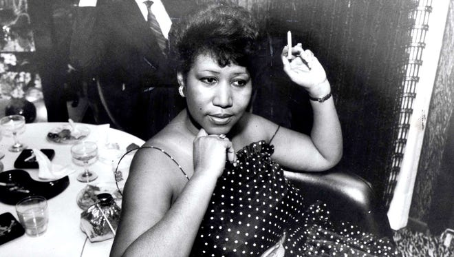Aretha Franklin relaxes with a cigarette circa 1984.