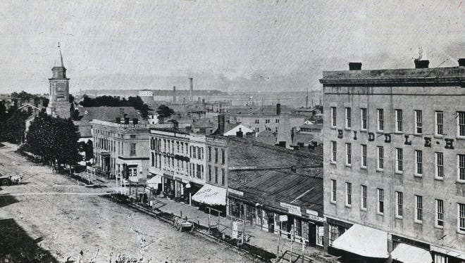This 1850s view looks east from the Biddle House hotel, right, built on the corner of Jefferson and Randolph in 1851. It was named for John Biddle, Detroit's mayor from 1827 to 1828. At left is the spire of St. John's German Lutheran Church.