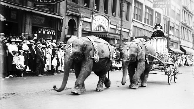 P.T. Barnum called his circus "The Greatest Show on Earth," and between the Civil War and World War II, the claim was hard to dispute. Traveling circuses were the most popular live entertainment of their day, coming to Detroit and other cities large and small. Above, young elephants pull a cart on Woodward during a circus parade in 1910.