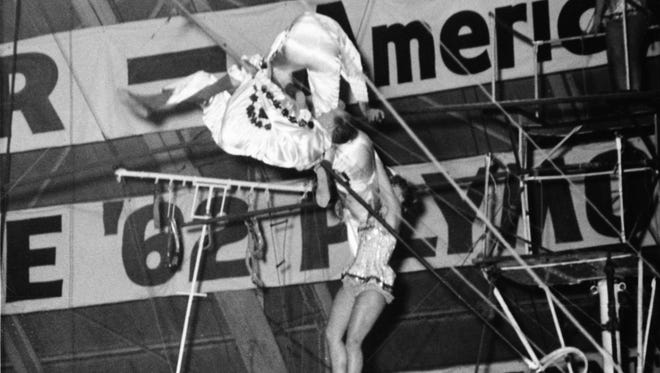 Tragedy struck in Detroit at the Shrine Circus on Jan. 30, 1962. Two members of the famed Wallenda circus family toppled to their deaths, and one fell and was paralyzed while trying to form a seven-person pyramid on the tightrope. Above, Jana Schepp, 17, and three Wallendas hold on to the high wire after the accident. Schepp dropped to an improvised net but bounced out and suffered a head injury. The others climbed back along the wire to safety.