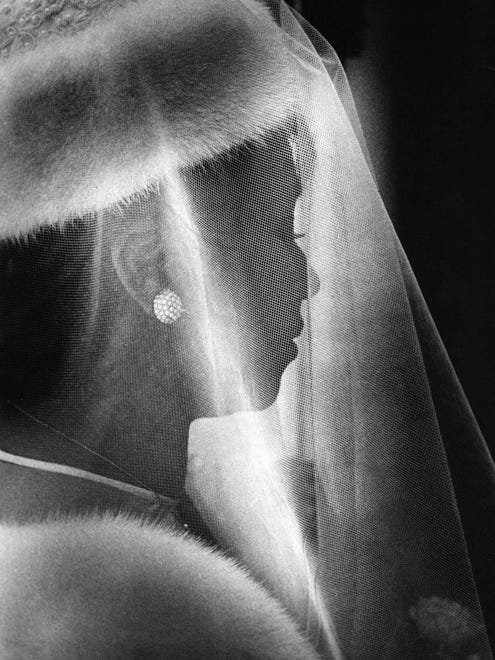 Aretha Franklin walks down the aisle on her wedding day,  April 11, 1978. She married actor Glynn Turman.