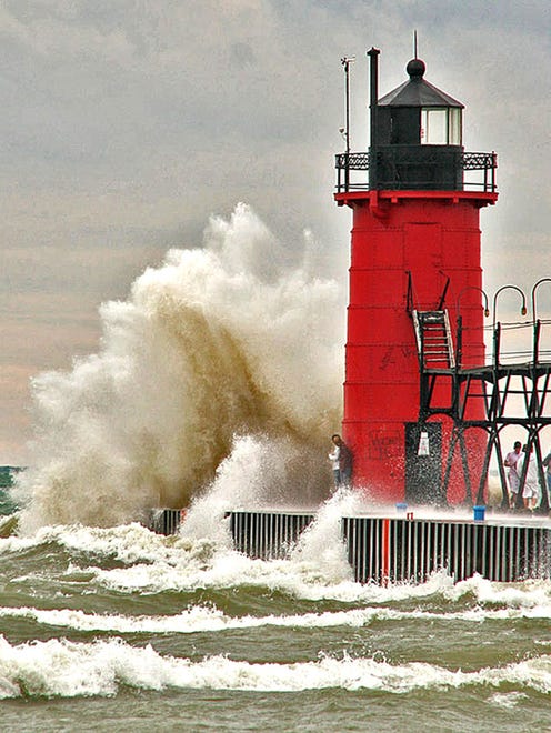 It may look like November, but Frank Wildasin of Farmington reports that it was actually a cold, windy day in August when his family visited South Haven.  "When we went to the beach, we all were in awe as the waves came crashing into the pier and the lighthouse," he said.