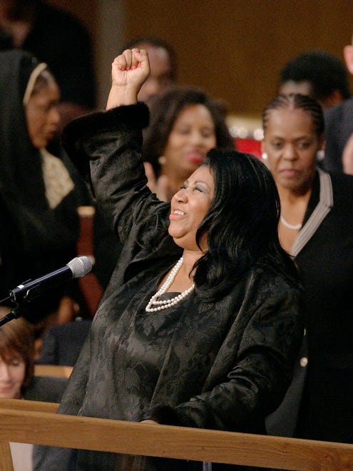 Aretha Franklin sings at the memorial service of Rosa Parks at Greater Grace Temple in Detroit on Nov. 2, 2005.