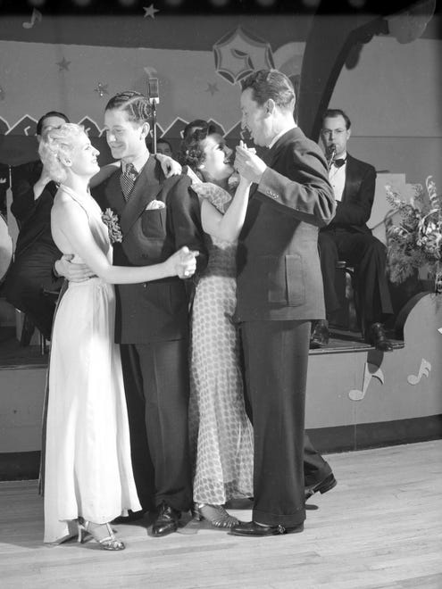 Two couples dance in front of unidentified band at the Trianon Dance Hall in February 1937. The ballrooms succeeded despite the Depression.