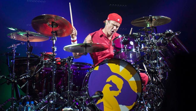 Homegrown rockstar Chad Smith, who grew up in Bloomfield Hills and graduated from Lahser High School, beats the drum skins as the Red Hot Chili Peppers play Joe Louis Arena in Detroit during their Getaway World Tour.