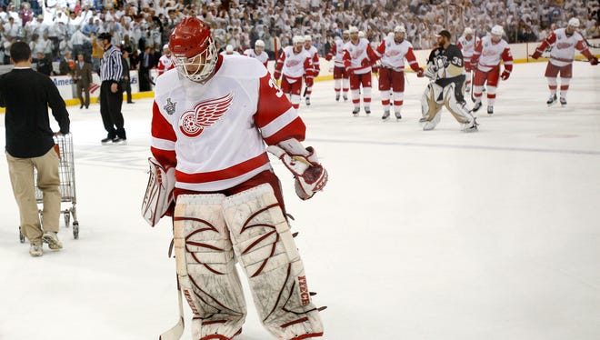 Detroit goalie Chris Osgood skates off the ice after the end of Game 3 of the Stanley Cup Finals at Mellon Arena, May 28, 2008.