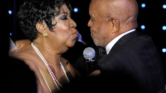 The Queen of Soul kisses Motown founder Berry Gordy after her performance at a Motown 50th anniversary gala at the Renaissance Center in Detroit on November 21, 2009.