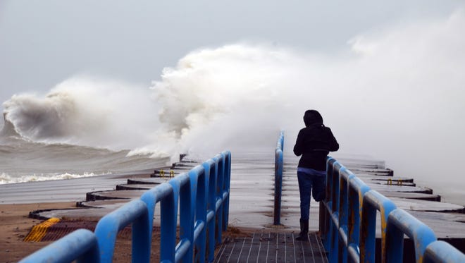 When she heard that 60 mph winds were coming out of the east in April, Gerry Buckel of Fostoria set out for Port Sanilac. "(Another) photographer ran out on the walkway and her leg was actually wrapped around the railing for safety, the wind was so strong," she said. "I've been a hobby photographer for years, and this was the first time I have been able to catch such great waves on Lake Huron."